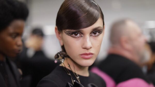 A model with black makeup and a black dress at Valentino FW 2020